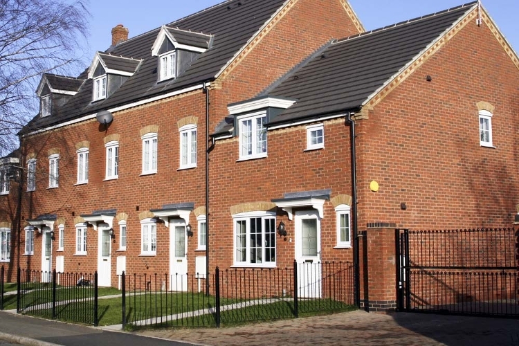 A photograph of a row of new houses.