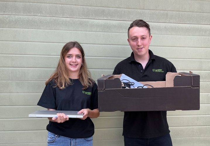 Green Machine Computers Staff holding donated Tech