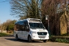 A picture of the West Berkshire Community Connect vehicle parked at bus stop. 
