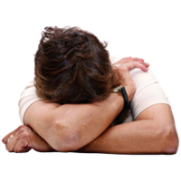 A person with their head in their arm.