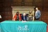 Councillor Jeff Brooks signing the Memorandum of Understanding.