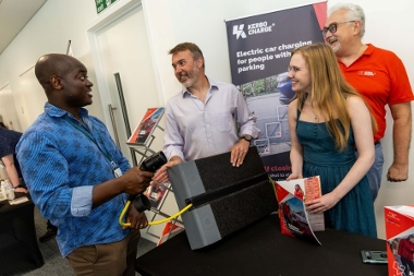 Service Lead for Climate Change Kofi  Abu-Gyamfi in discussion with Kerbo Charge representatives.